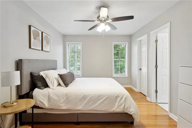 a bedroom with a bed and a lamp on table