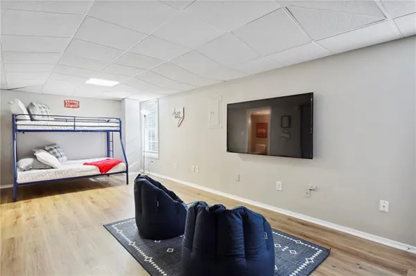 a bathroom with a toilet a sink and a mirror