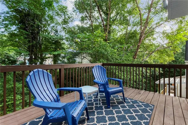 a view of a chair and table in the balcony
