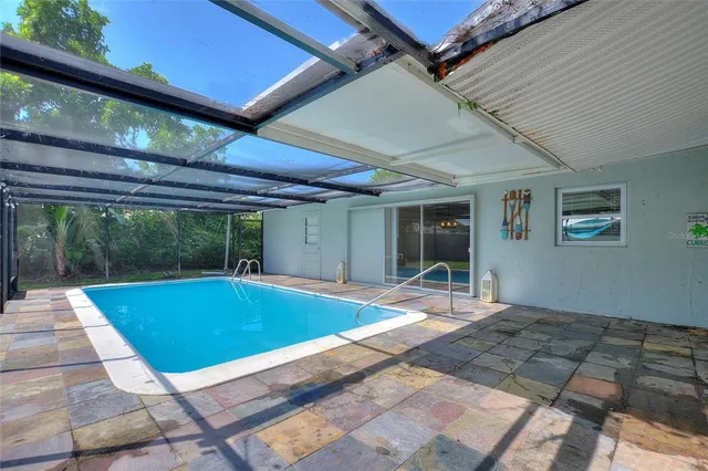 a view of swimming pool with seating space