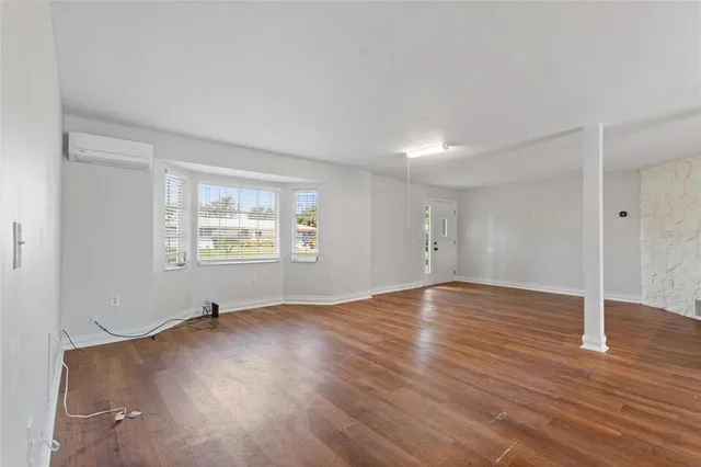 a view of a living room and hardwood floor