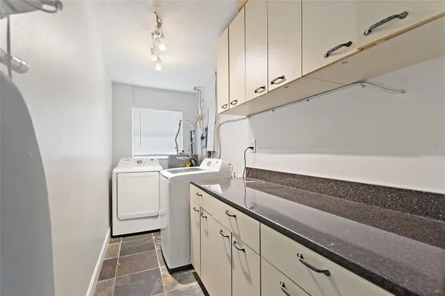 a bathroom with a toilet sink and a mirror