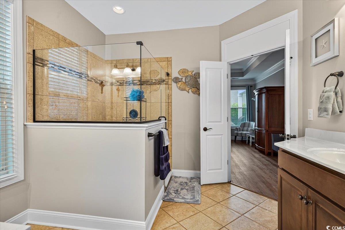 1719 Maplecress Way Myrtle Beach, SC 29577 - Photo 20 of 40 Full bath with vanity, a walk in shower, tile patterned floors, recessed lighting, and ornamental molding