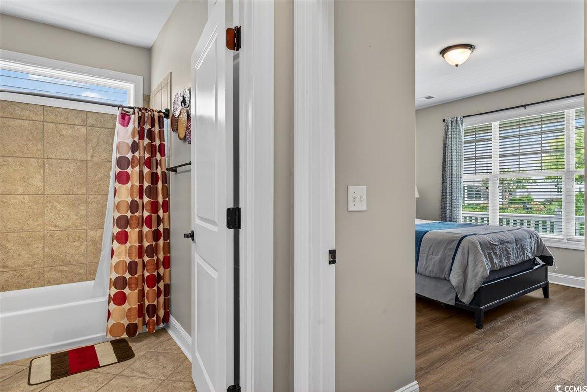 1719 Maplecress Way Myrtle Beach, SC 29577 - Photo 23 of 40 Ensuite bathroom with shower / bath combo and baseboards