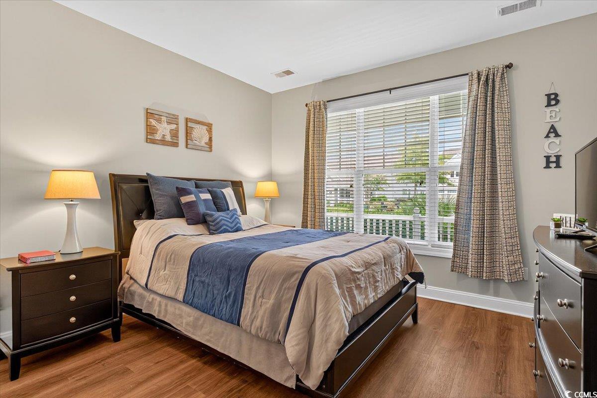 1719 Maplecress Way Myrtle Beach, SC 29577 - Photo 24 of 40 Bedroom featuring wood finished floors and multiple windows