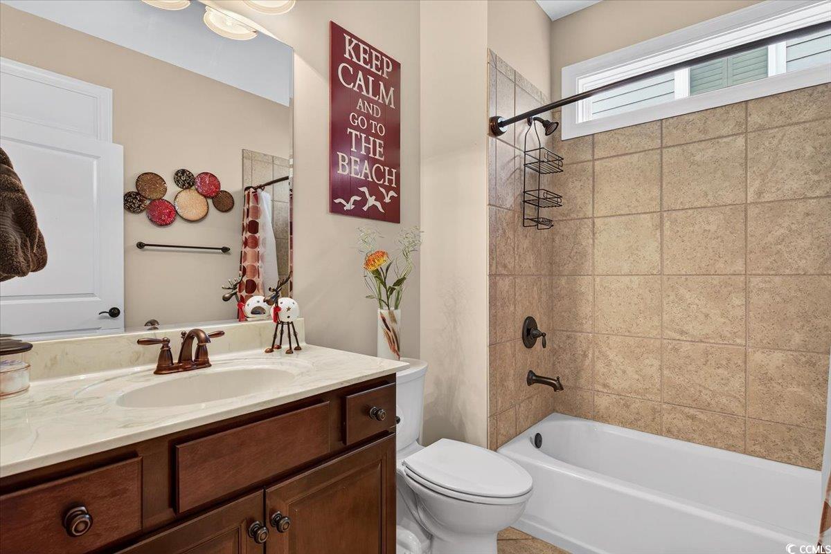 1719 Maplecress Way Myrtle Beach, SC 29577 - Photo 26 of 40 Bathroom featuring vanity and shower / bath combination with curtain