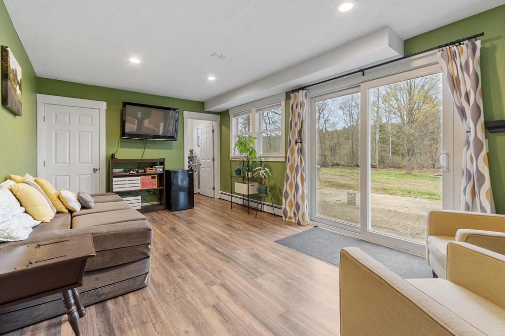 101 Williams Road Ashburnham, MA 01430 - Photo 25 of 42 a living room with furniture and a flat screen tv