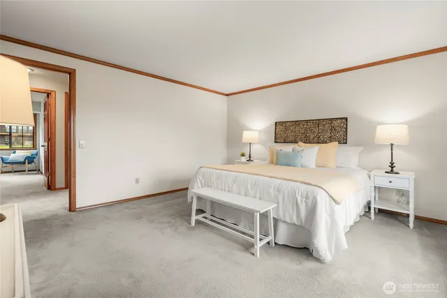 a bed room with a bed and a night stand