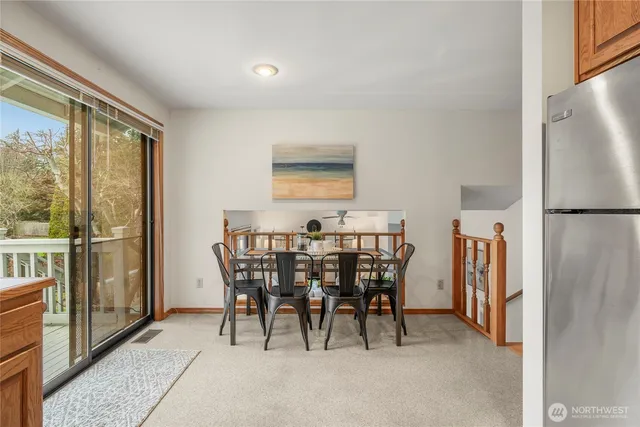 a view of a dining room with furniture window and outside view