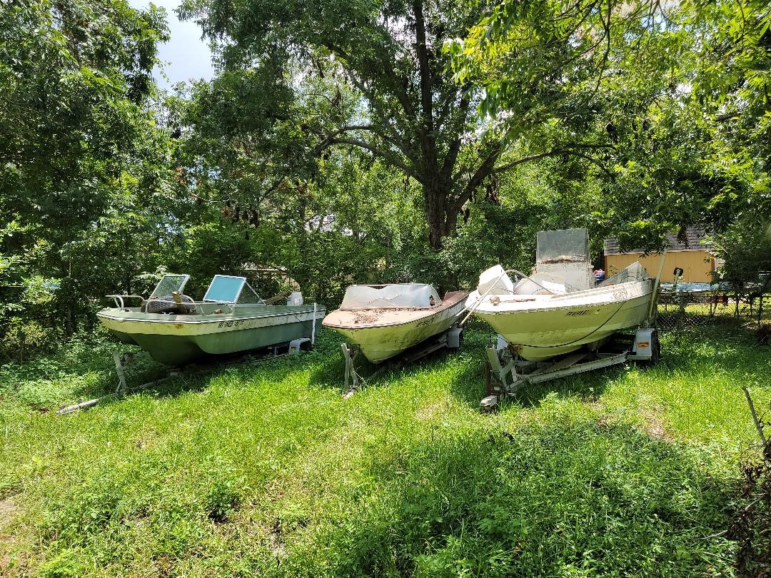 421 Ave B La Marque, TX 77568 - Photo 6 of 8 a backyard of a house with a fireplace and outdoor seating