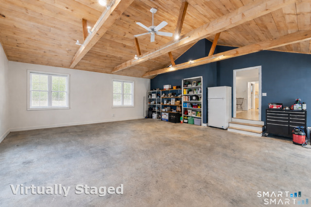 a view of an empty room with furniture