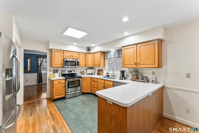a kitchen with a sink stove and refrigerator