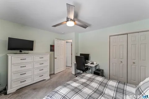 a view of a livingroom with furniture and a flat screen tv