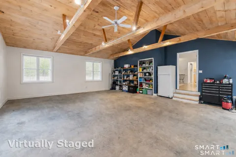 a view of an empty room with furniture