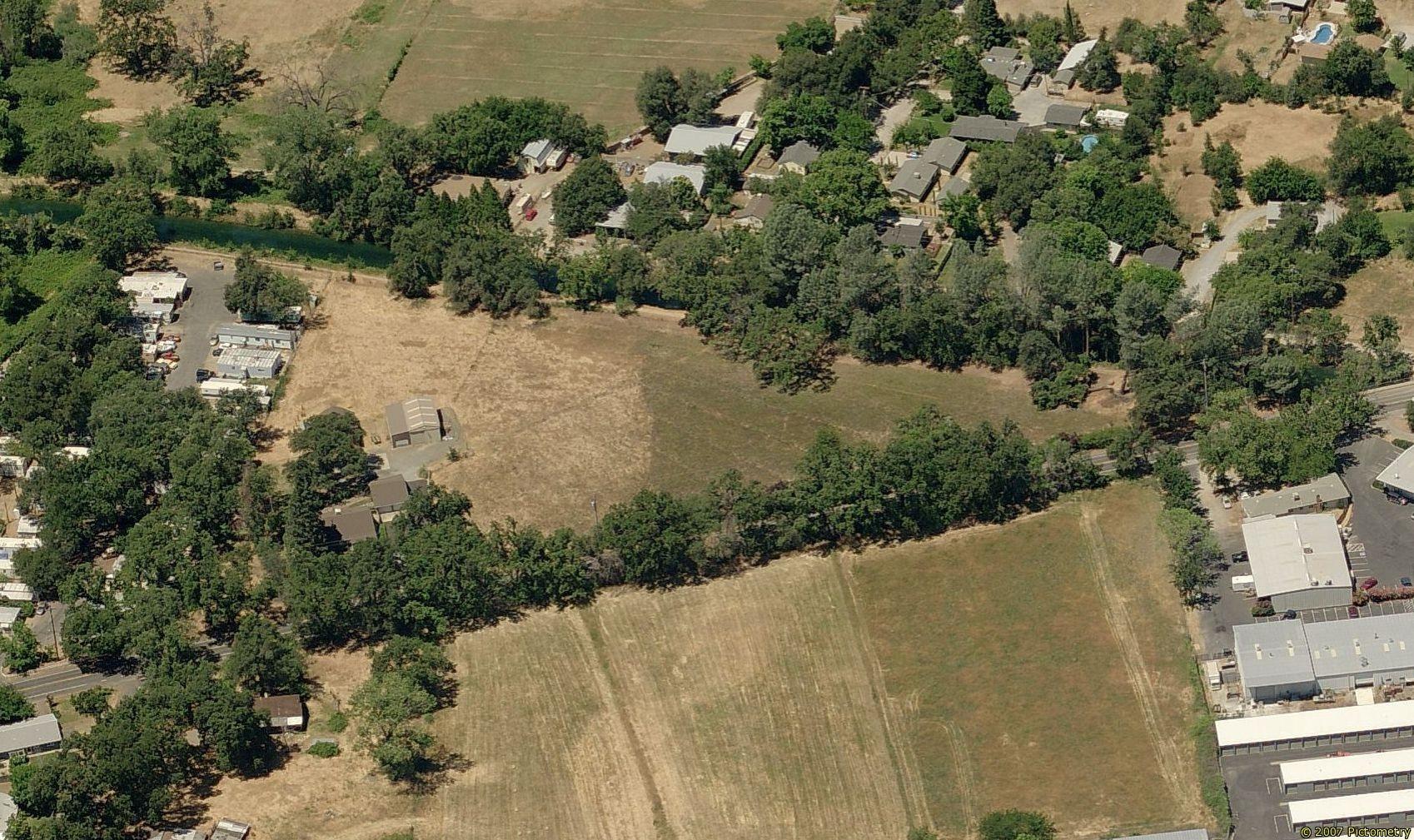 5690 Cedars Road Redding, CA 96001 - Photo 3 of 4 an aerial view of a house with a yard