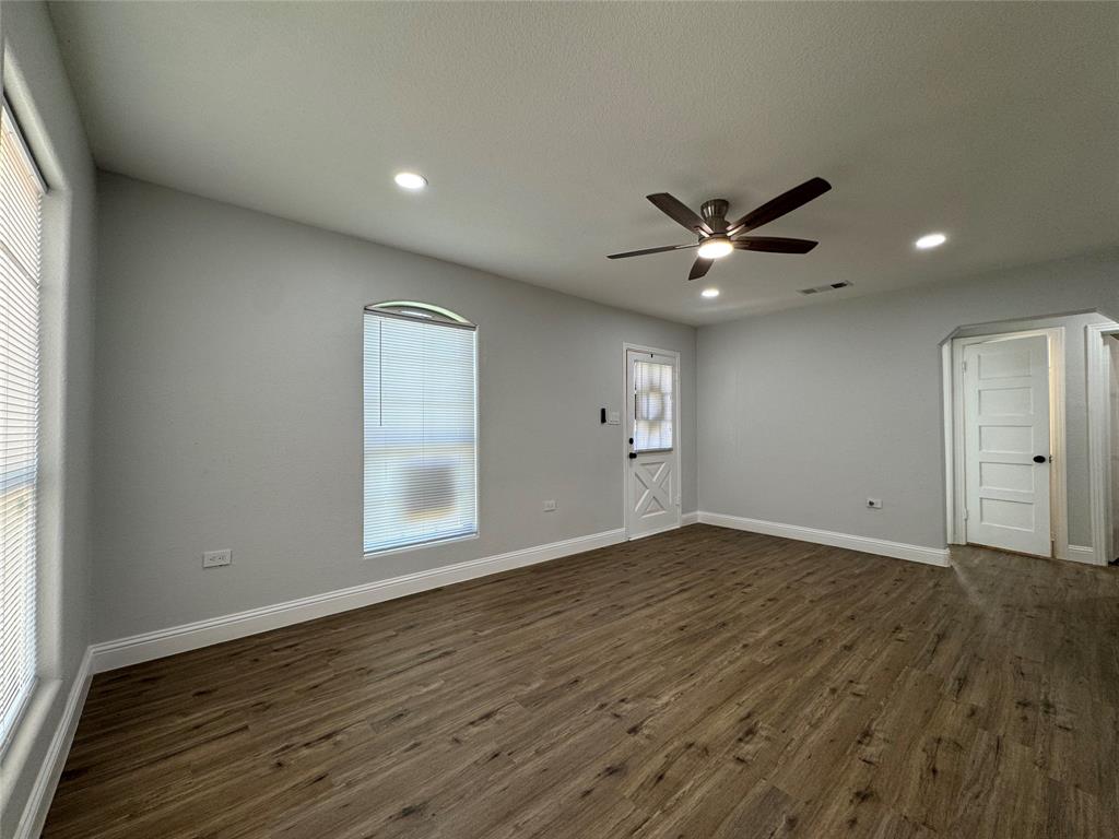 2909 Alexander Avenue Waco, TX 76708 - Photo 5 of 27 Unfurnished room featuring dark wood-style floors, ceiling fan, and recessed lighting
