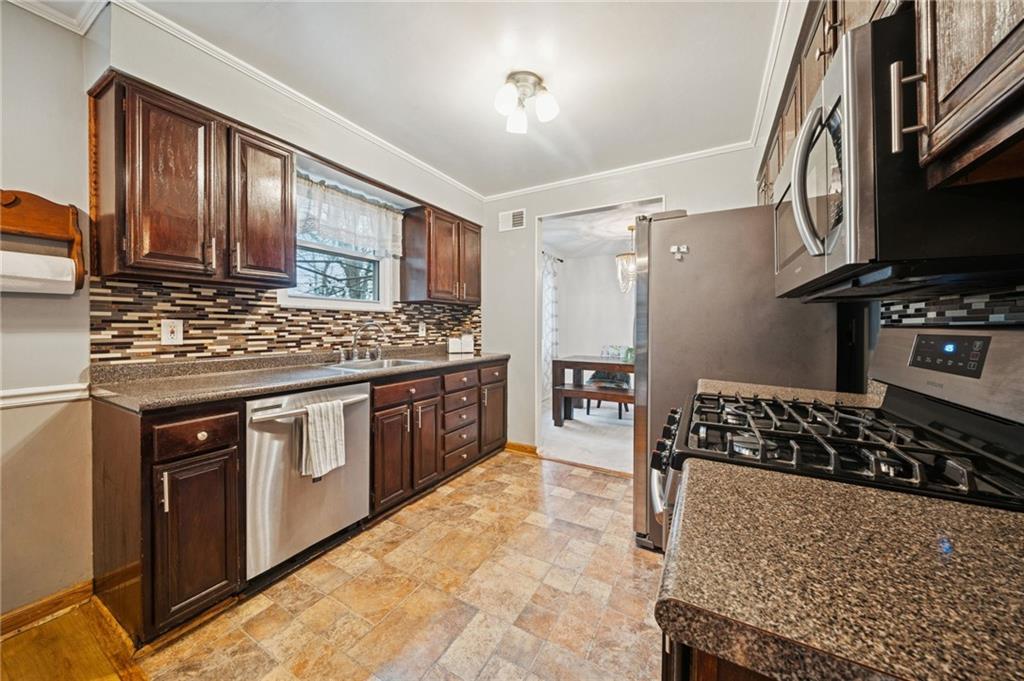 Elegant Countertops over Cherry Cabinetry