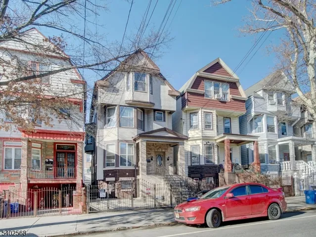 a front view of residential houses with street