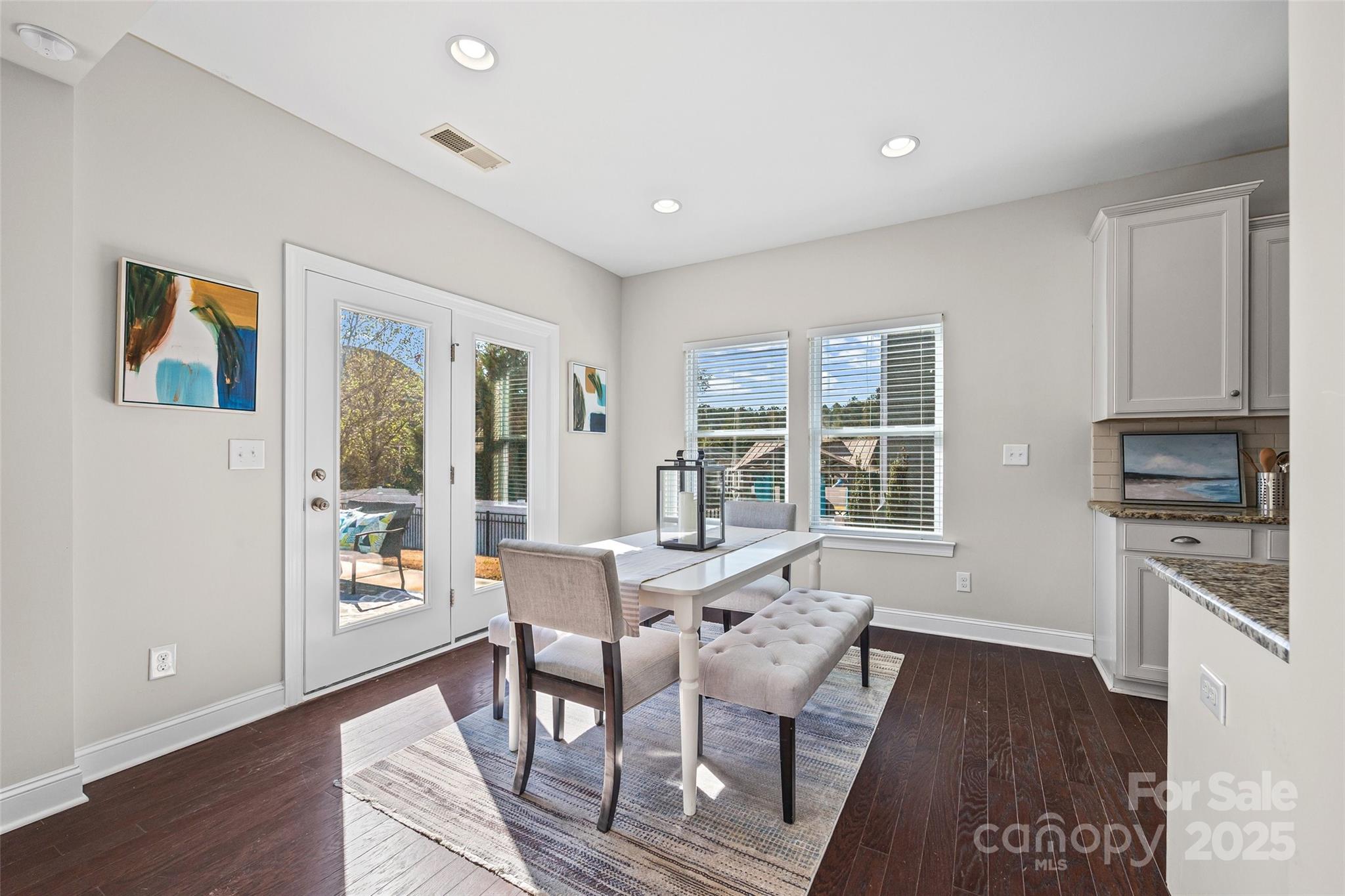84324 Masterson Court Lancaster, SC 29720 - Photo 11 of 45 a view of a dining room with furniture window and wooden floor