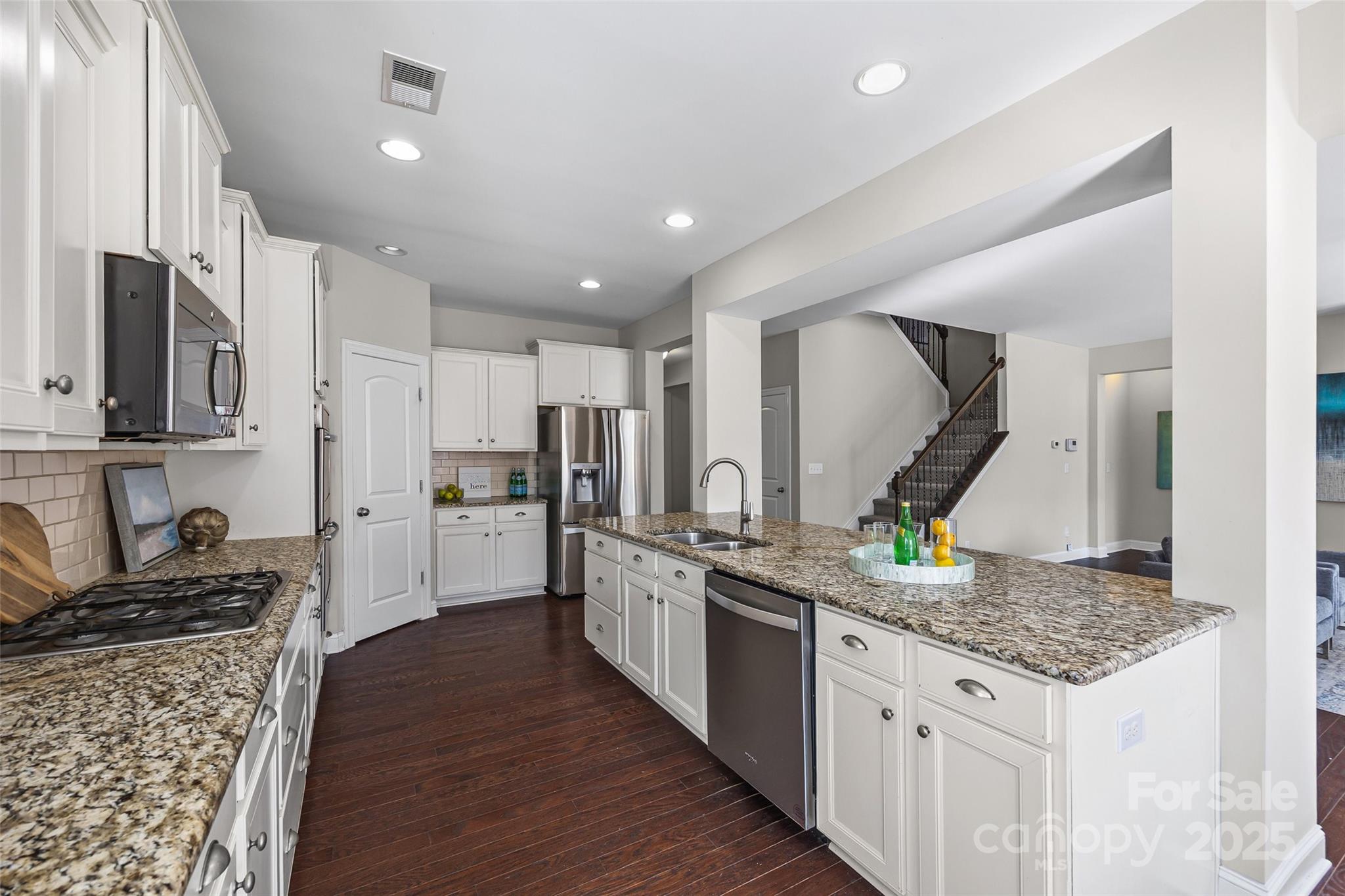 84324 Masterson Court Lancaster, SC 29720 - Photo 12 of 45 a kitchen with stainless steel appliances granite countertop a sink stove and refrigerator