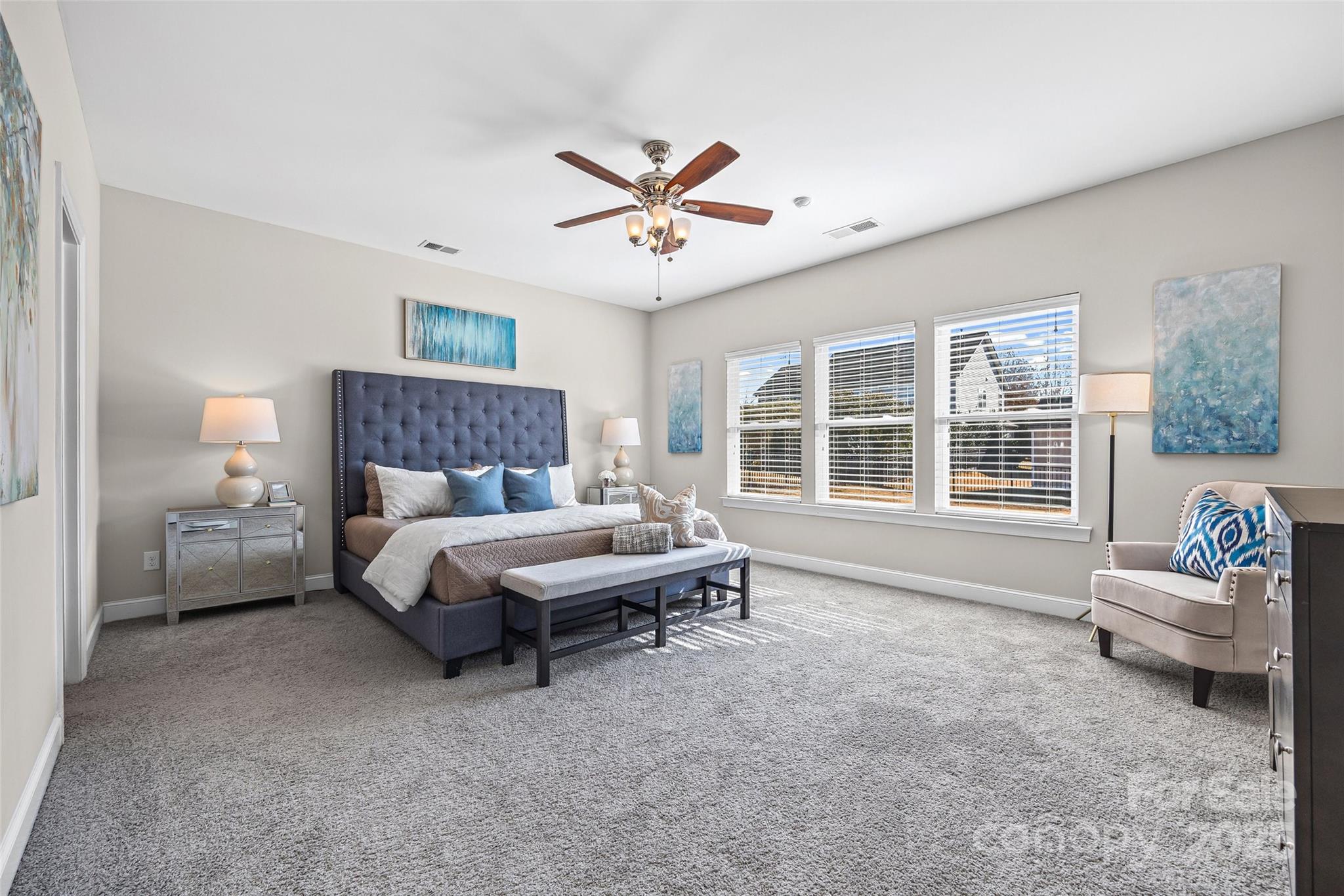 84324 Masterson Court Lancaster, SC 29720 - Photo 16 of 45 a spacious bedroom with a bed and a large window