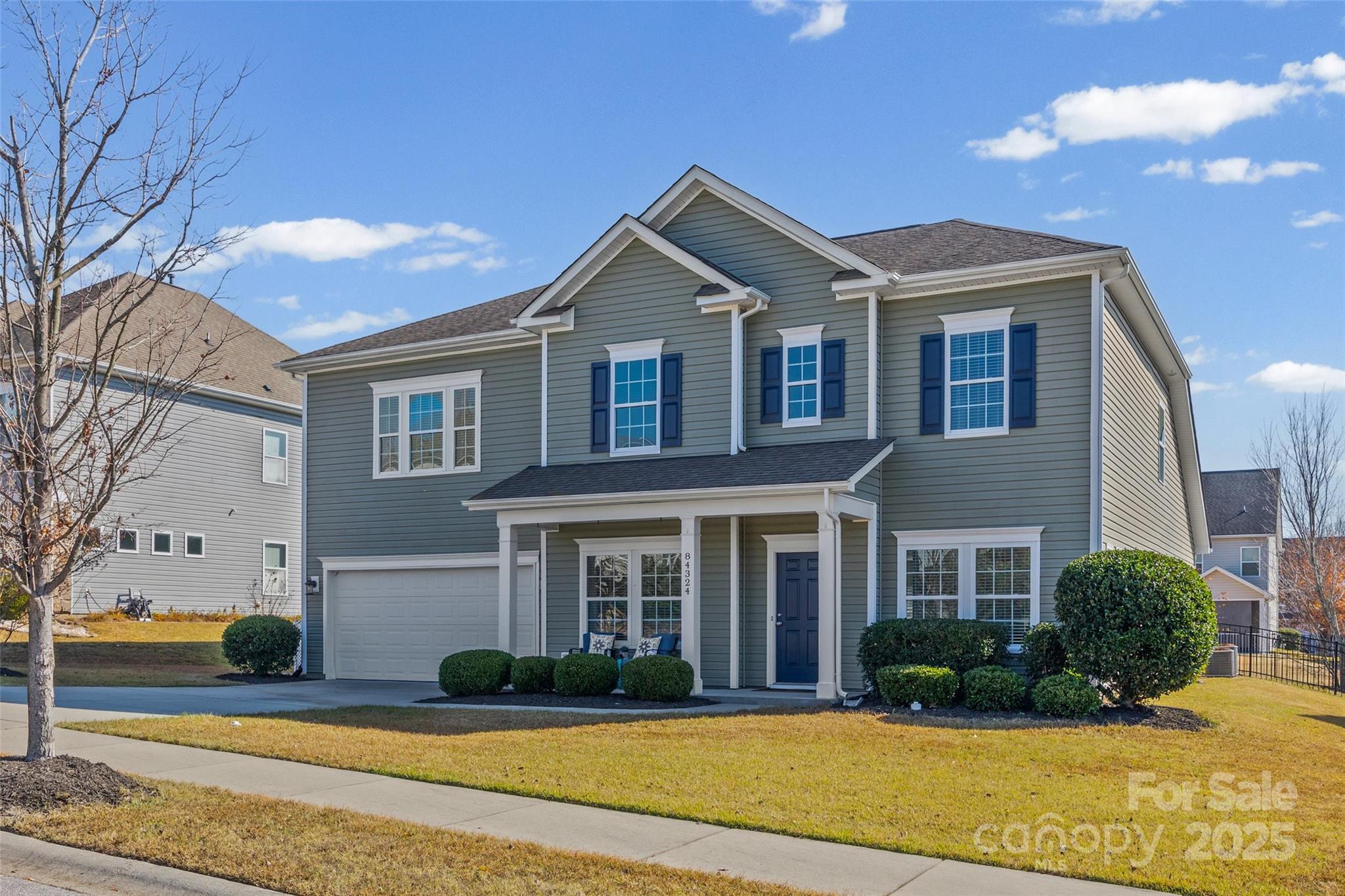 84324 Masterson Court Lancaster, SC 29720 - Photo 2 of 45 a front view of a house with garden and porch