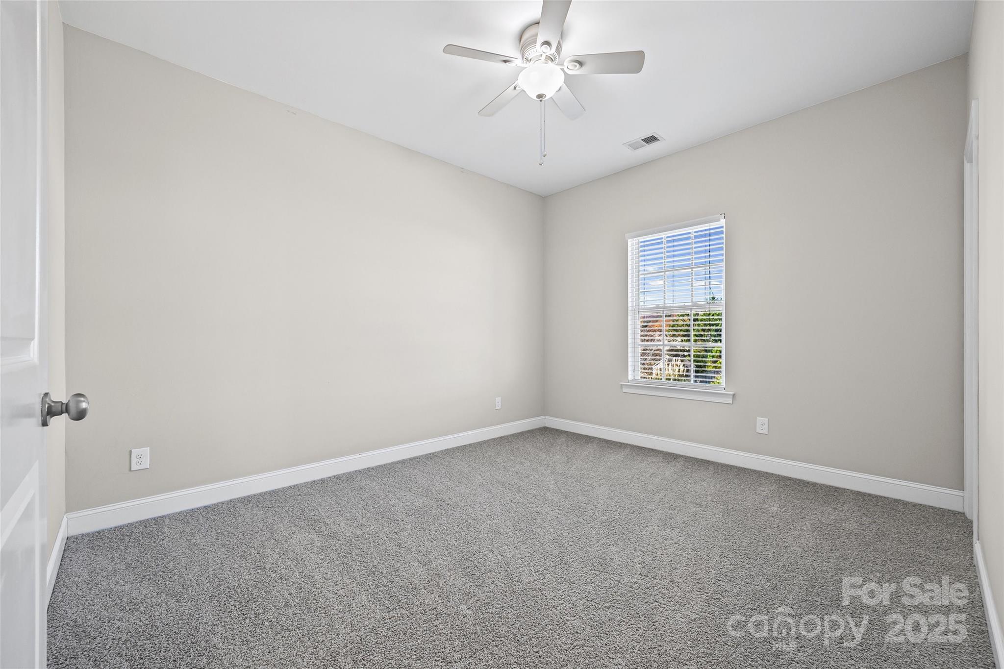 84324 Masterson Court Lancaster, SC 29720 - Photo 25 of 45 an empty room with a window and a fan