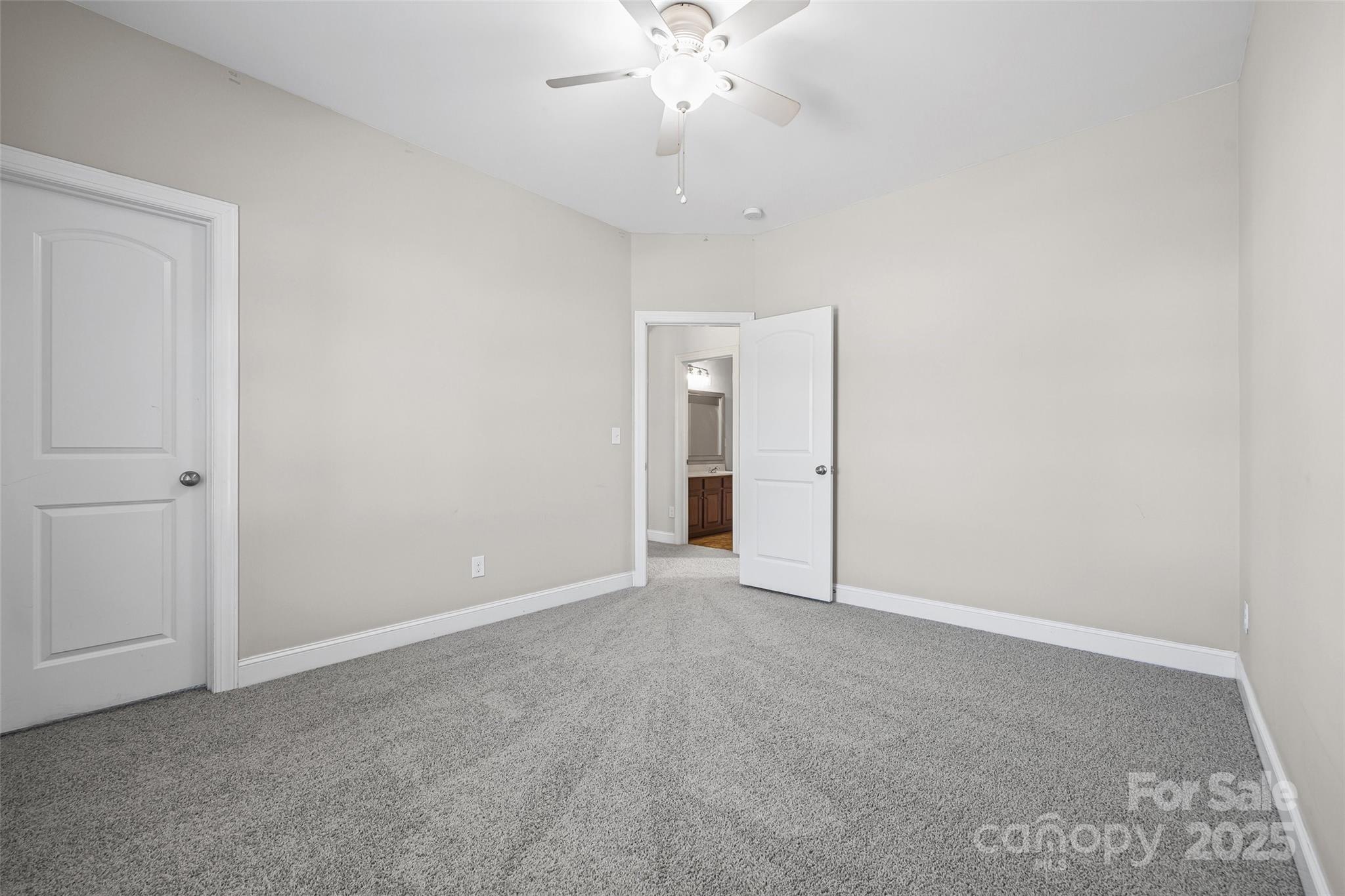 84324 Masterson Court Lancaster, SC 29720 - Photo 26 of 45 a view of an empty room with a chandelier fan