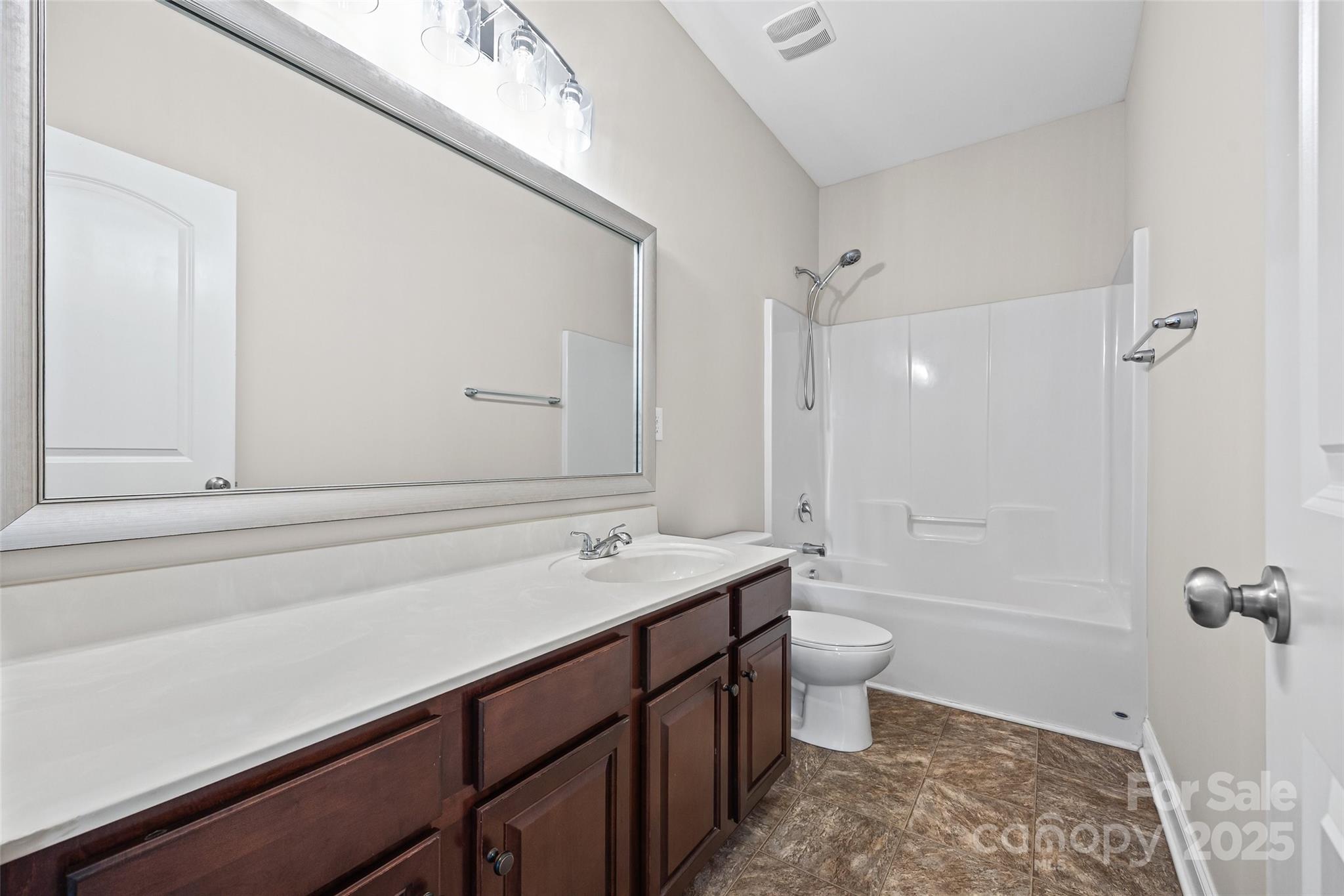 84324 Masterson Court Lancaster, SC 29720 - Photo 27 of 45 a bathroom with a sink a toilet and shower