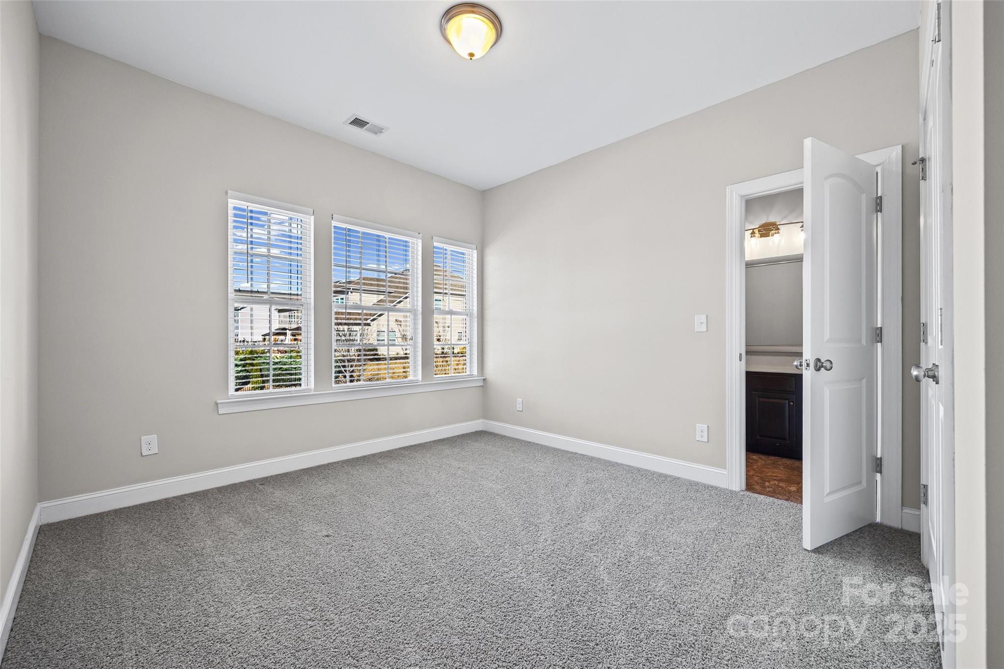 84324 Masterson Court Lancaster, SC 29720 - Photo 28 of 45 an empty room with windows and closet