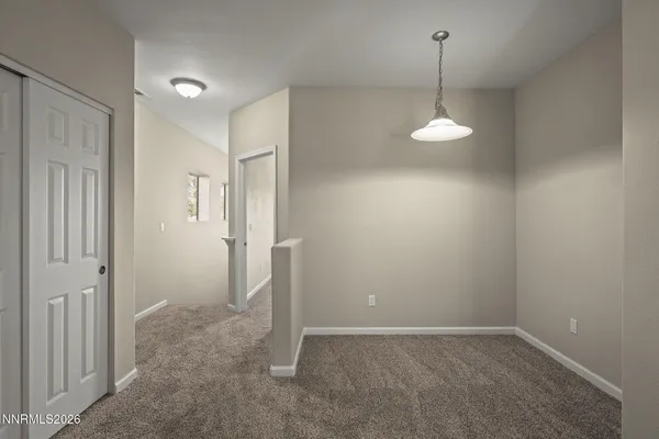 an empty room with a empty space and a window