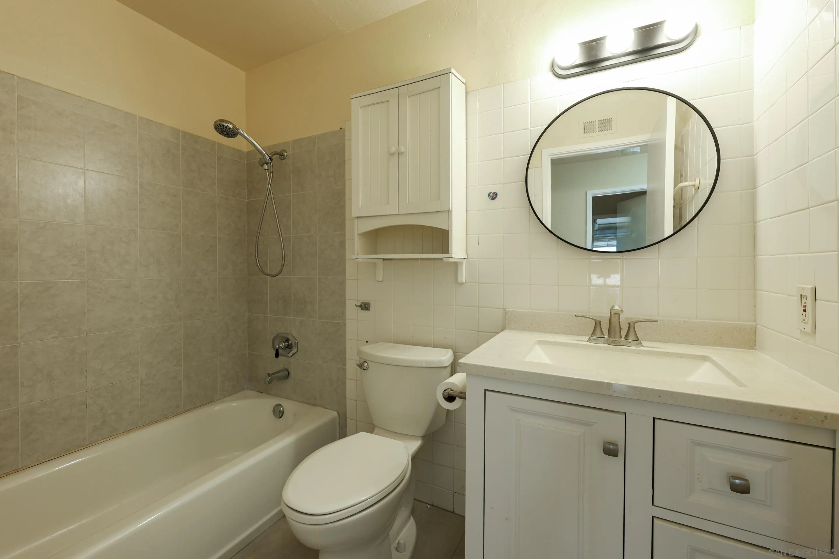 10866 Sandy Hook Road San Diego, CA 92126 - Photo 14 of 15 a bathroom with a sink a toilet and a mirror