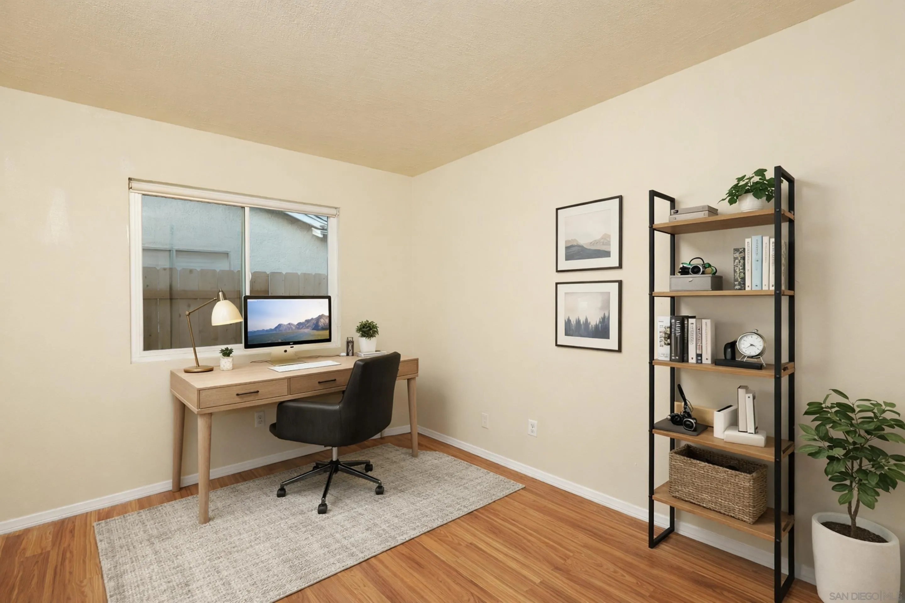 10866 Sandy Hook Road San Diego, CA 92126 - Photo 3 of 15 a work room with furniture and wooden floor