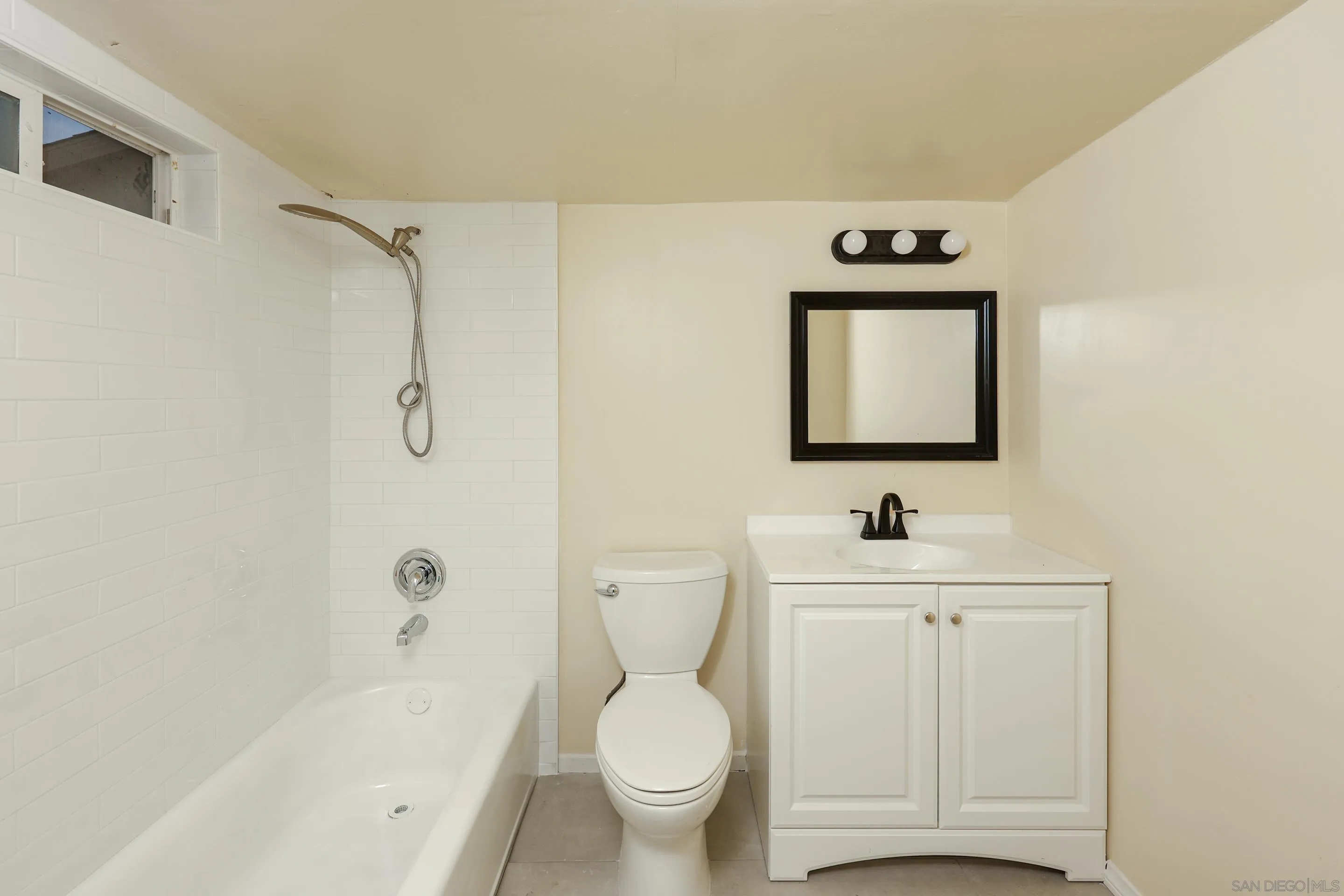 10866 Sandy Hook Road San Diego, CA 92126 - Photo 8 of 15 a bathroom with a toilet sink and mirror
