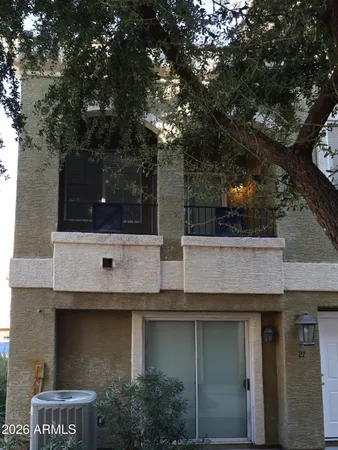 a view of a building with a tree