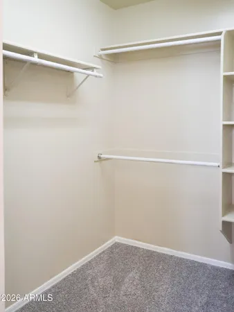 a view of an empty walk in closet