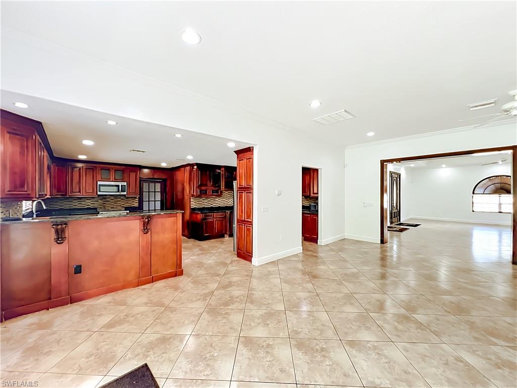 4210 South Hiawassee Road Orlando, FL 32835 - Photo 14 of 49 a view of a kitchen with a sink