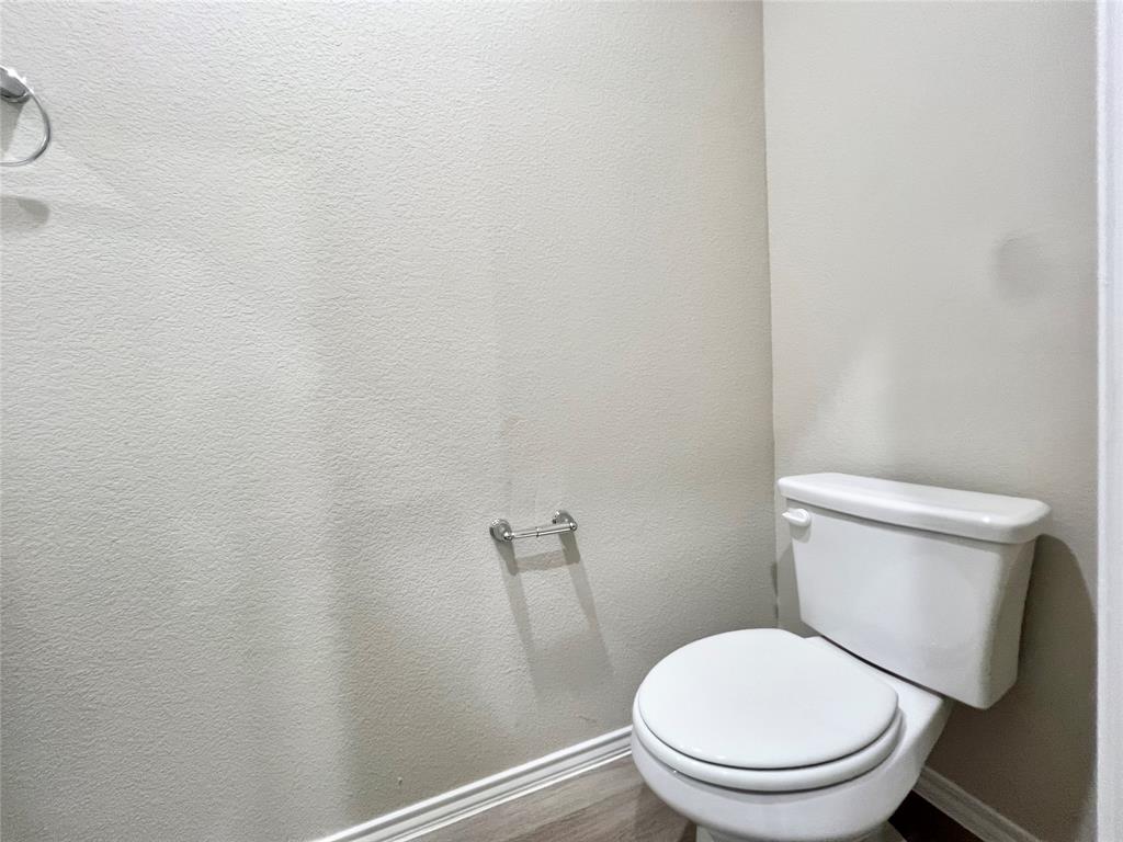 3501 East Renfro Street, Unit 202 Burleson, TX 76028 - Photo 13 of 33 a white toilet sitting next to a shower