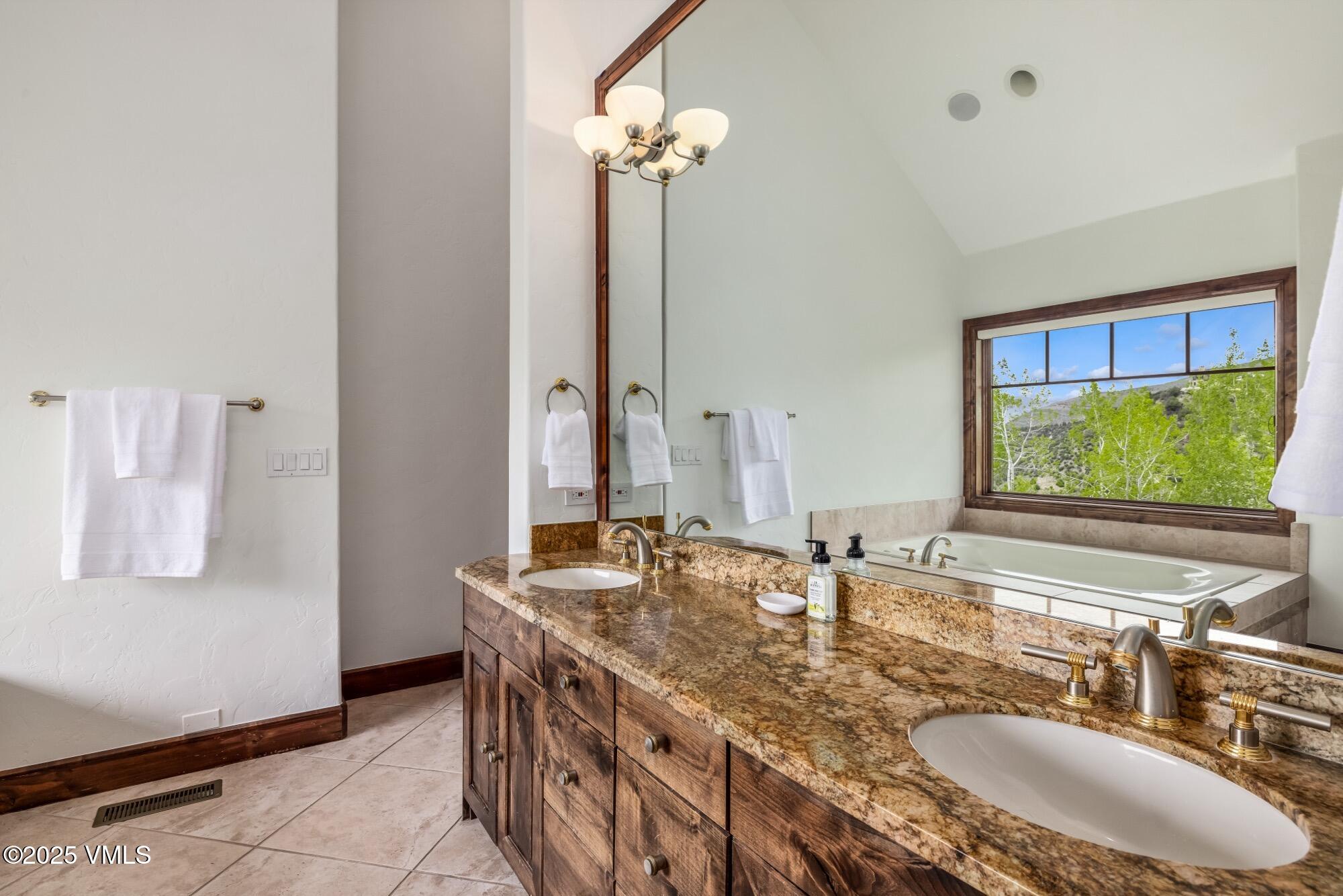 1122 Red Draw Edwards, CO 81632 - Photo 36 of 54 a bathroom with a double vanity sink and a mirror
