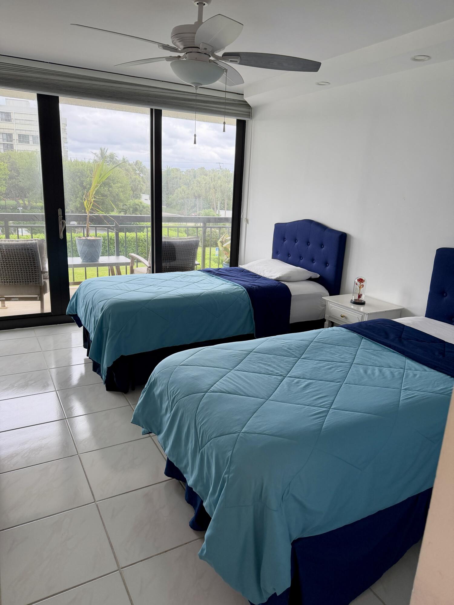 2001 North Ocean Boulevard, Unit 301 Boca Raton, FL 33431 - Photo 16 of 41 a bedroom with two beds and a large window