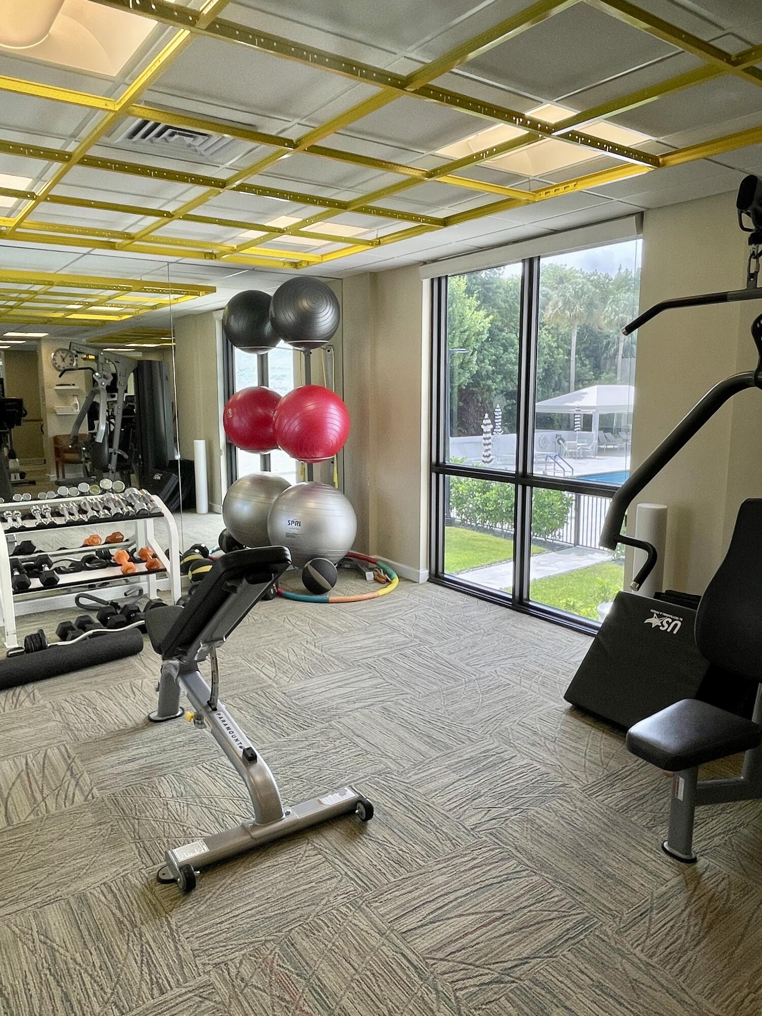 2001 North Ocean Boulevard, Unit 301 Boca Raton, FL 33431 - Photo 28 of 41 a lobby with furniture and a floor to ceiling window