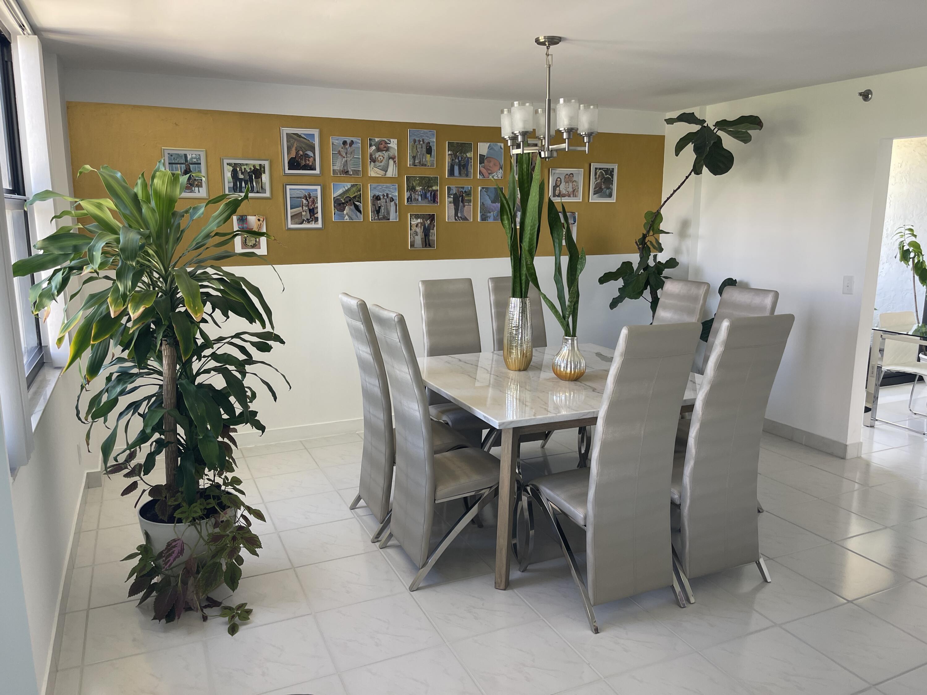 2001 North Ocean Boulevard, Unit 301 Boca Raton, FL 33431 - Photo 9 of 41 a view of a dining room with furniture and chandelier