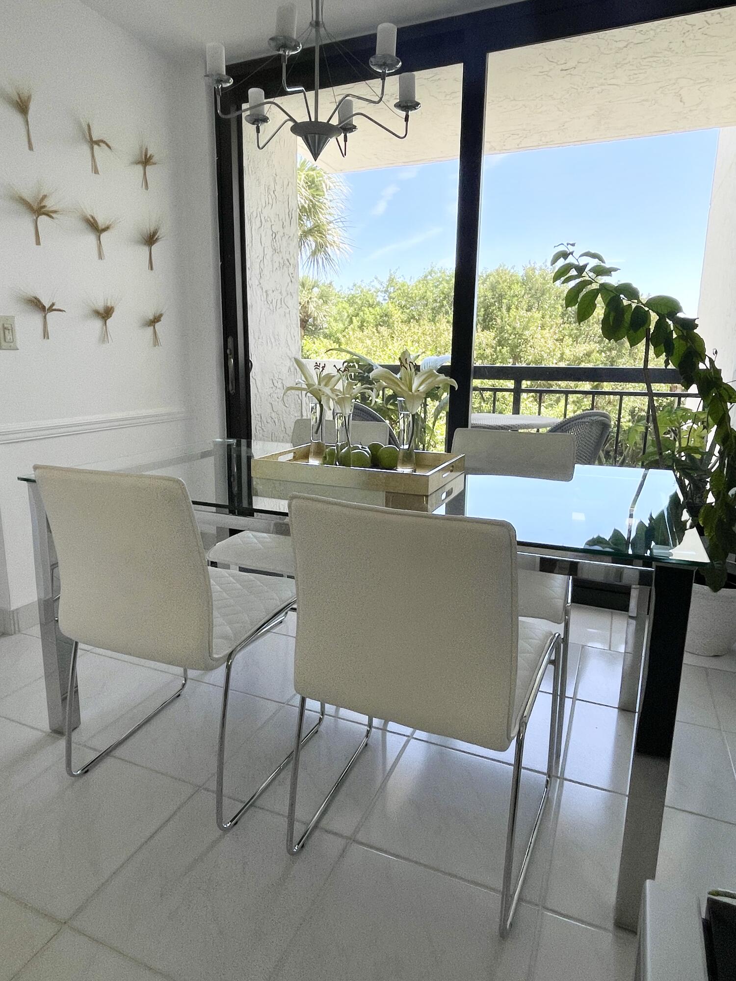 2001 North Ocean Boulevard, Unit 301 Boca Raton, FL 33431 - Photo 10 of 41 a view of a dining room with furniture window and outside view