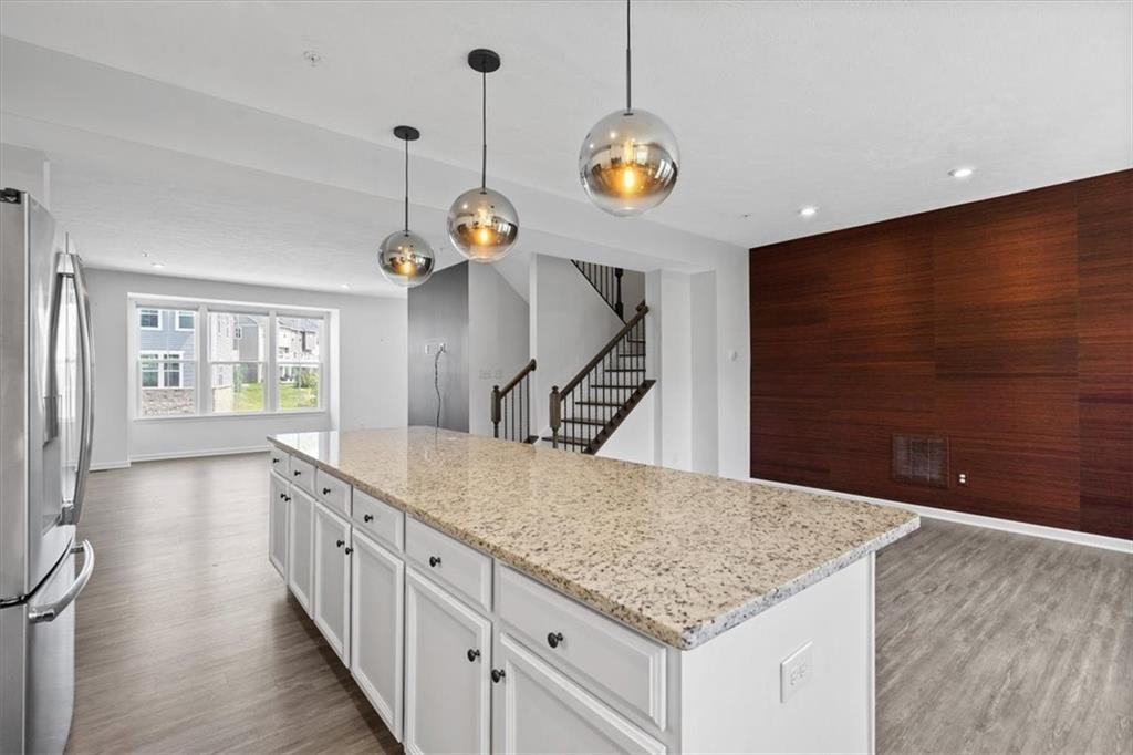 150 Curtis Court Pittsburgh, PA 15237 - Photo 12 of 29 a kitchen with stainless steel appliances granite countertop a sink and a wooden floor