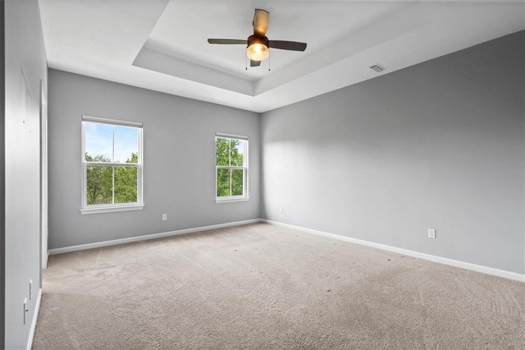 150 Curtis Court Pittsburgh, PA 15237 - Photo 15 of 29 an empty room with windows and a ceiling fan