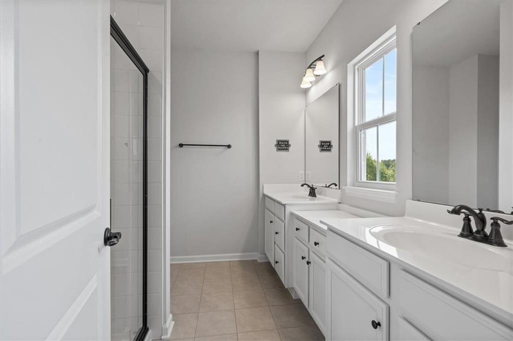 150 Curtis Court Pittsburgh, PA 15237 - Photo 17 of 29 a spacious bathroom with a double vanity sink mirror and next to a window