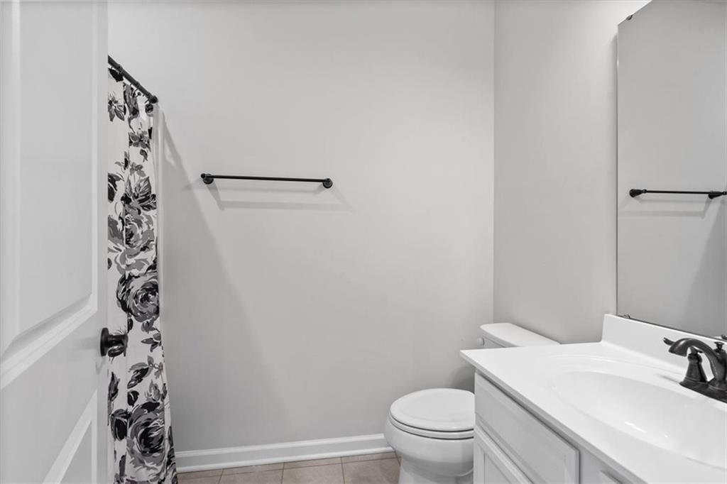 150 Curtis Court Pittsburgh, PA 15237 - Photo 24 of 29 a bathroom with a sink a toilet and shower curtain