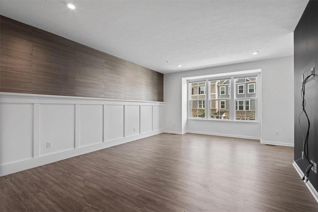 150 Curtis Court Pittsburgh, PA 15237 - Photo 4 of 29 a view of an empty room with a window and wooden floor