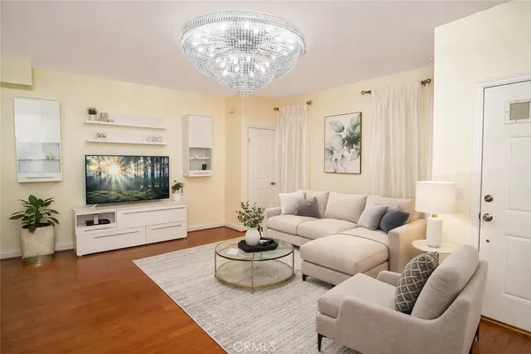 a living room with furniture and a flat screen tv