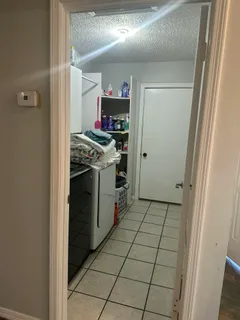 a bed sitting in a room next to a window